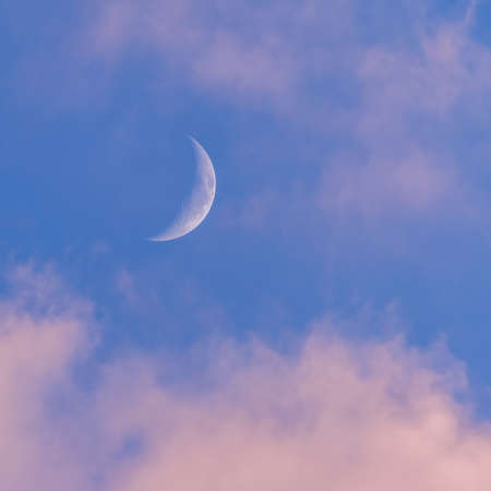 Sunset sky with large crescent moon, evening sky backgroundの写真素材