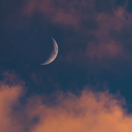 Sunset sky with large crescent moon, evening sky backgroundの写真素材