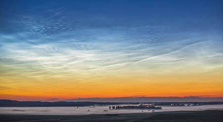 Night shining - Noctilucent clouds at night, panoramaの写真素材