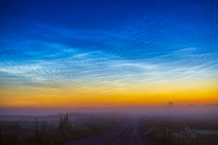 Night shining - Noctilucent clouds at night, panoramaの写真素材