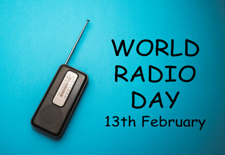 World Radio Day 13 February text with radio on blue background. Selective focusの写真素材