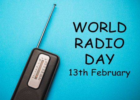 World Radio Day 13 February text with radio on blue background. Selective focusの写真素材