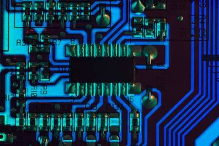 Blue circuit board background, close-up details of a microchipの写真素材