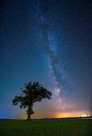 Night landscape with colorful Milky Way, autumn skyの写真素材