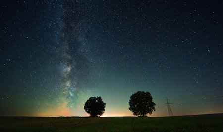Night landscape with colorful Milky Way, autumn skyの写真素材