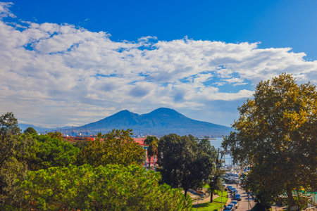 Enjoy the stunning panoramic view of Naples with the majestic Vesuvius in the backgroundの写真素材
