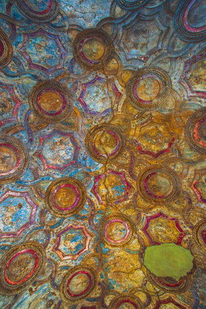 Explore the vibrant ceiling art with intricate circular patterns and captivating textures. Ancient ruins of Pompei city, Naples, Italy.の写真素材