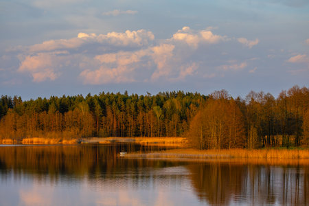 A Serene Lake Reflection with Vibrant and Colorful sunset colorsの写真素材