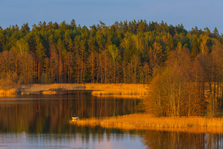A Serene Lake Reflection with Vibrant and Colorful sunset colorsの写真素材