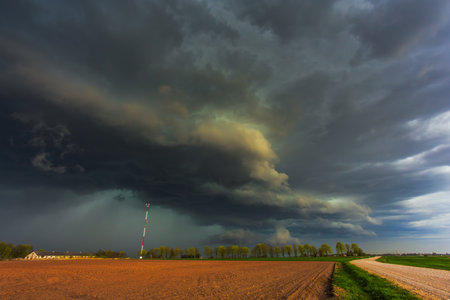 Dramatic storm clouds in the sky, dark severe storm clouds, supercell.の写真素材