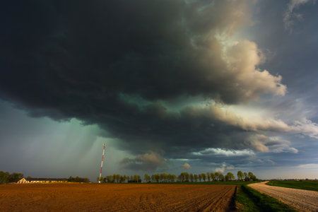 Dramatic storm clouds in the sky, dark severe storm clouds, supercell.の写真素材