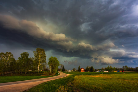 Dramatic storm clouds in the sky, dark severe storm clouds, supercell.の写真素材