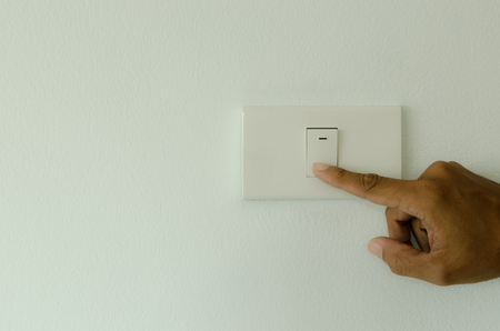 hand trun off light,save energy conceptの写真素材