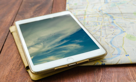 Tablet and map backgroundの写真素材