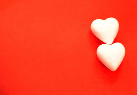 wite hearts on red backgraundの写真素材