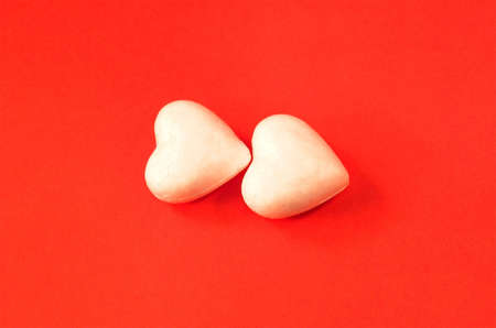 wite hearts on red backgraundの写真素材