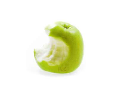 eating green apple on white backgroundの写真素材
