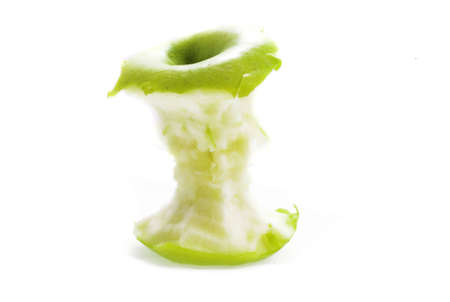 eating green apple on white backgroundの写真素材