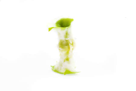 eating green apple on white backgroundの写真素材