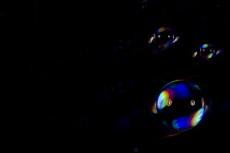 drop air  whit rainbow on black background の写真素材