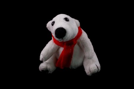 white bear white red muffler on black backgroundの写真素材