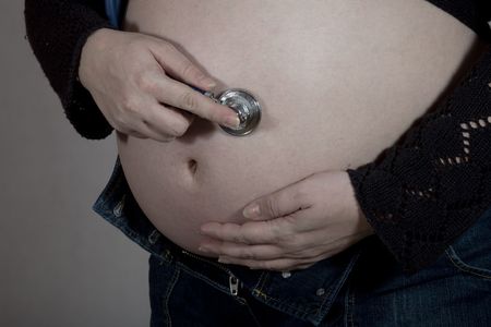 Young female in thrid trimester of pregnancy