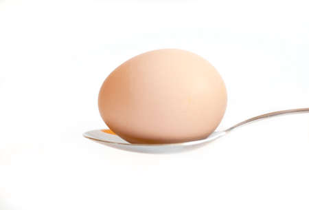 Easter egg kept on the cutlery on a white egg, Easter,  white, isolated  background, celebrateの写真素材