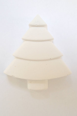 White plaster decorative Christmas tree on isolated backgroundの写真素材