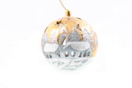 shiny gold hand-painted Christmas bauble on a white backgroundの写真素材