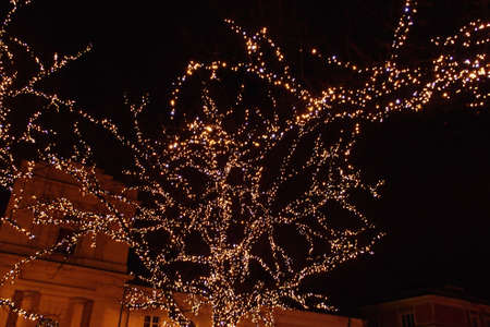 Light colored Christmas decorations at night the streets of Warsaw, Poland