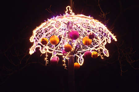 Light colored Christmas decorations at night the streets of Warsaw, Polandの写真素材