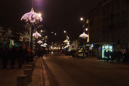Light colored Christmas decorations at night the streets of Warsaw, Polandの写真素材