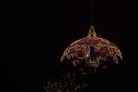 Light colored Christmas decorations at night the streets of Warsaw, Polandの写真素材