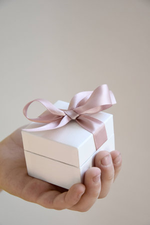 gift in a white box with a pink bowの写真素材