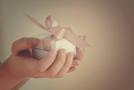 gift in a white box with a pink bowの写真素材