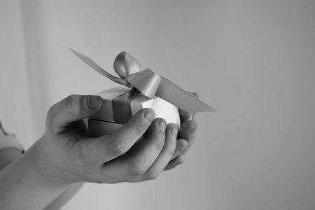gift in a white box with a pink bowの写真素材