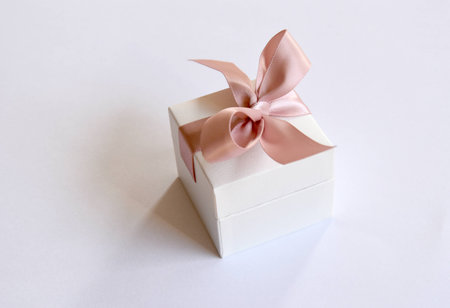 gift in a white box with a pink bowの写真素材