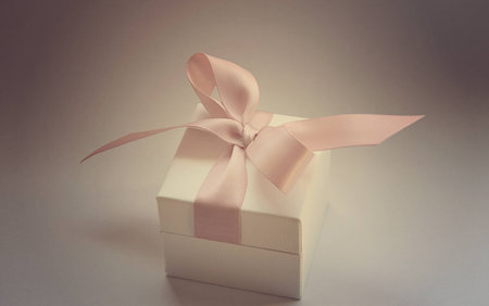 gift in a white box with a pink bowの写真素材