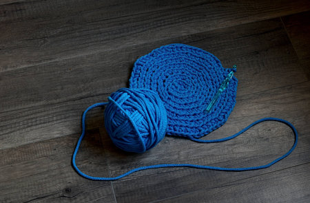 Blue crochet knitting manual pad on the table hand knitting,の写真素材