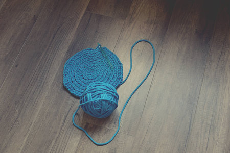 Blue crochet knitting manual pad on the table hand knitting,の写真素材