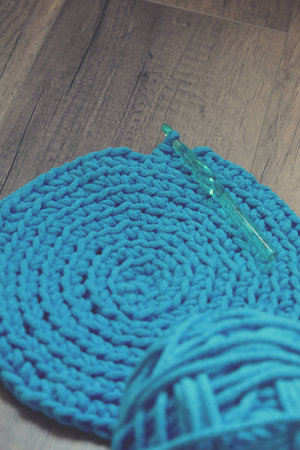 Blue crochet knitting manual pad on the table hand knitting,の写真素材