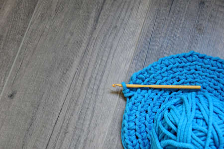 Blue crochet knitting manual pad on the table hand knitting,の写真素材