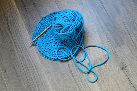 Blue crochet knitting manual pad on the table hand knitting,の写真素材