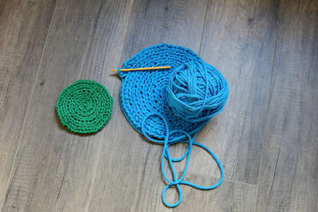 Blue crochet knitting manual pad on the table hand knitting,の写真素材