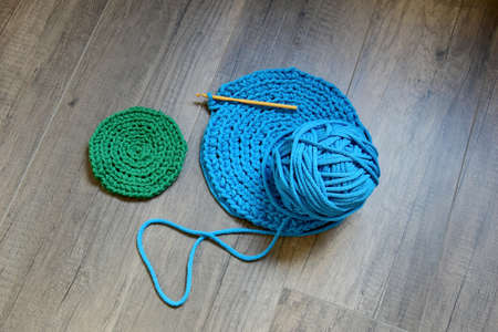 Blue crochet knitting manual pad on the table hand knitting,の写真素材