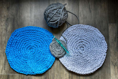 grey handmade cotton cord tablecloths on crochet hookの写真素材