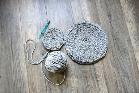 grey handmade cotton cord tablecloths on crochet hookの写真素材