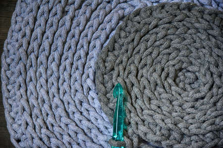 grey handmade cotton cord tablecloths on crochet hookの写真素材