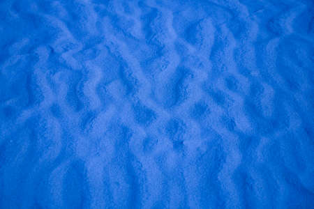 nice blue background with sand in the shape of sand wavesの写真素材