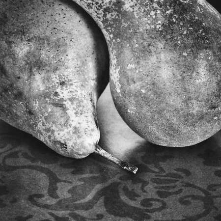 still life with green pears on a wooden backgroundの写真素材